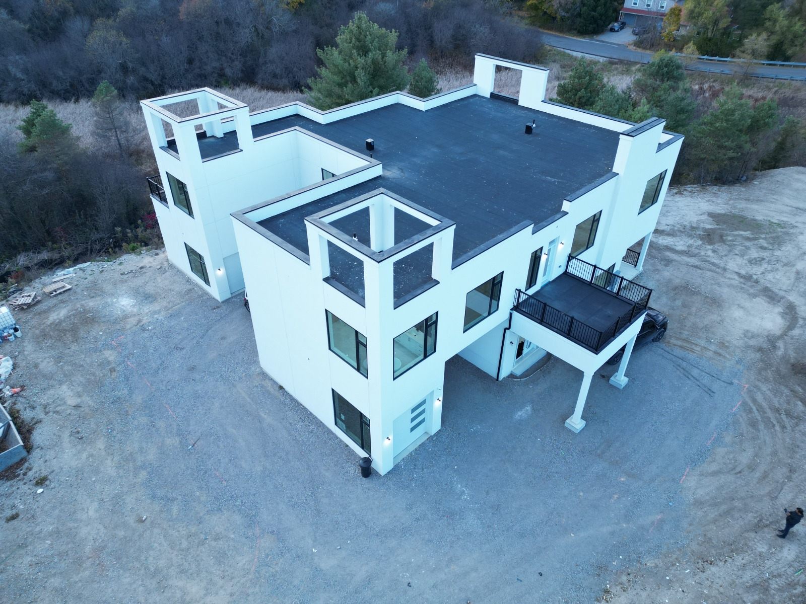 Aerial view of a completed modern custom home construction project by Manefa