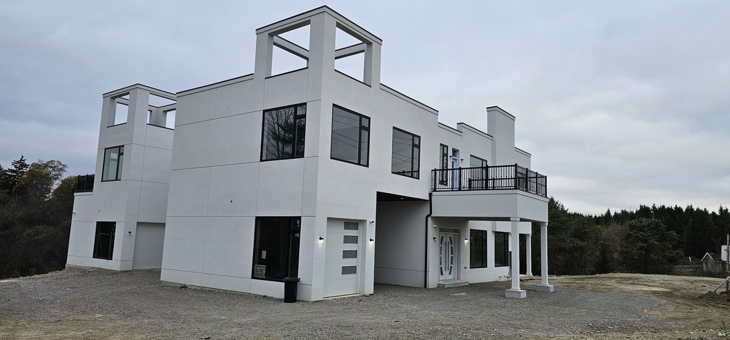 Manefa custom home project photo showing foundation, framing, or exterior construction progress: Custom Home Build
