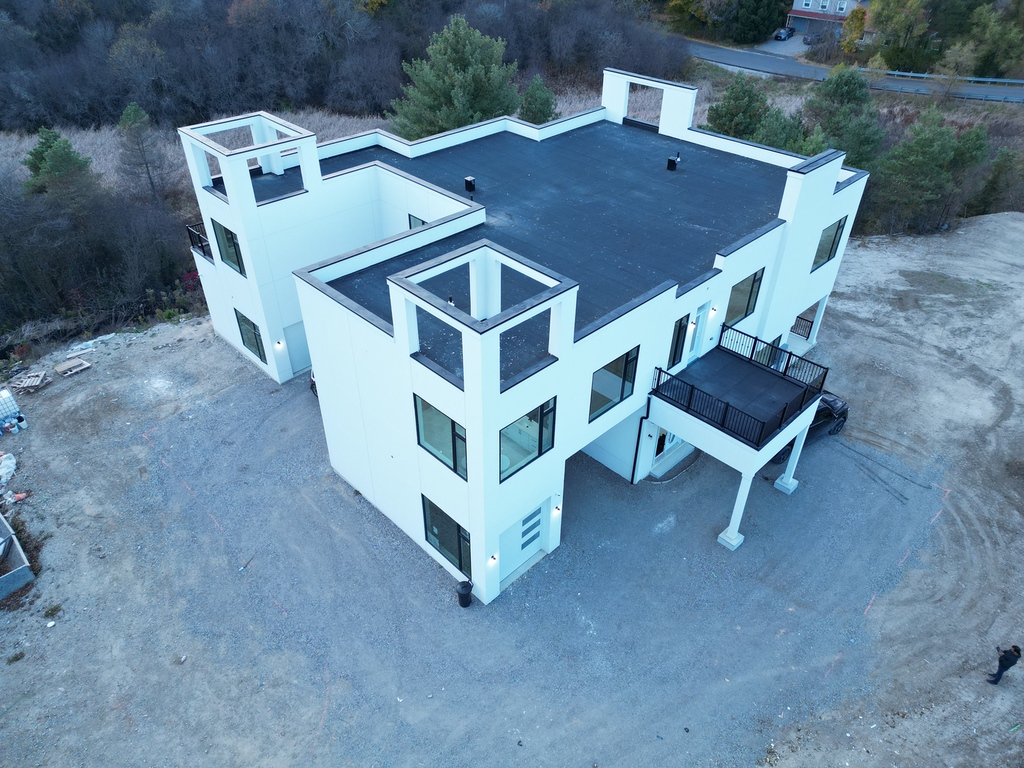 Manefa custom home project photo showing foundation, framing, or exterior construction progress: Aerial Custom Home Finish