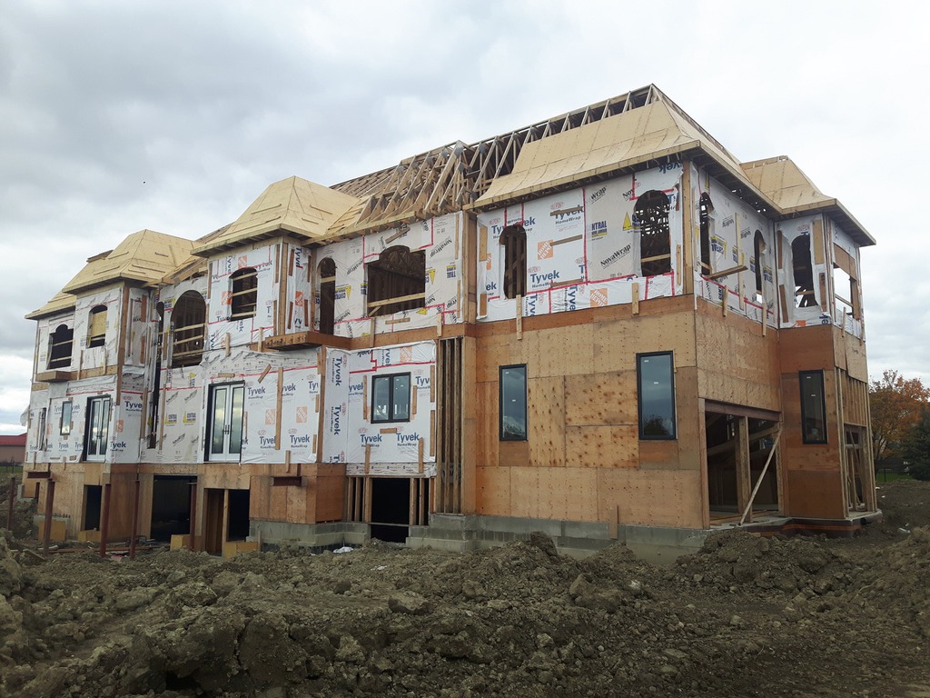 Manefa custom home project photo showing foundation, framing, or exterior construction progress: Custom Home Exterior Progress