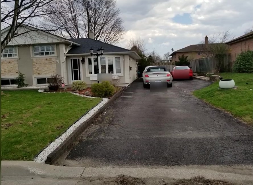 Original driveway and side yard before construction of the attached garage addition