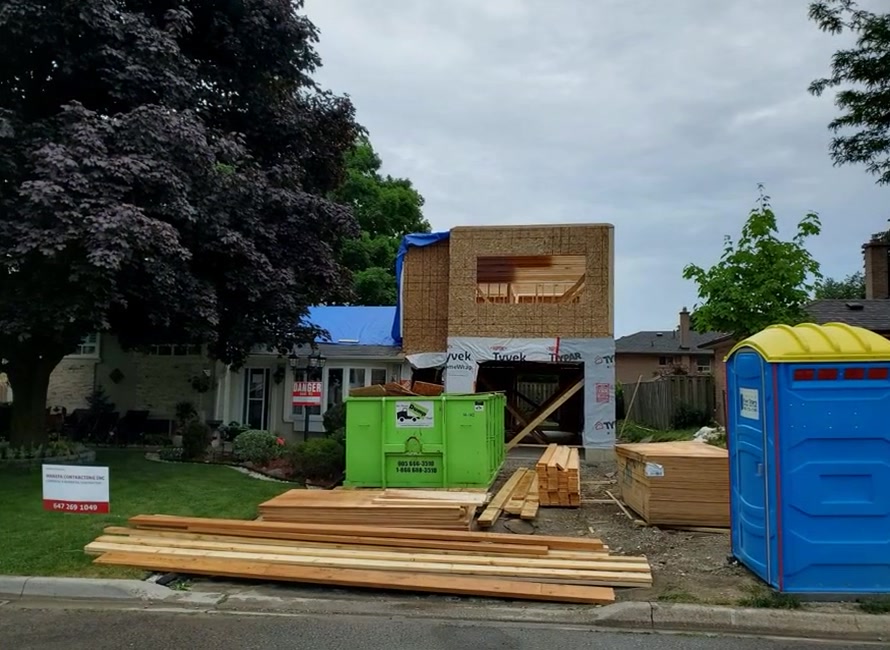 Wood framing for the new garage and upper-level structure