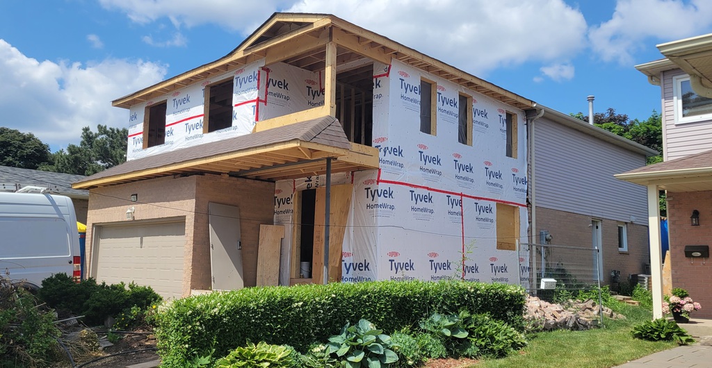 Second story addition framing and exterior wrap progress before final finishes